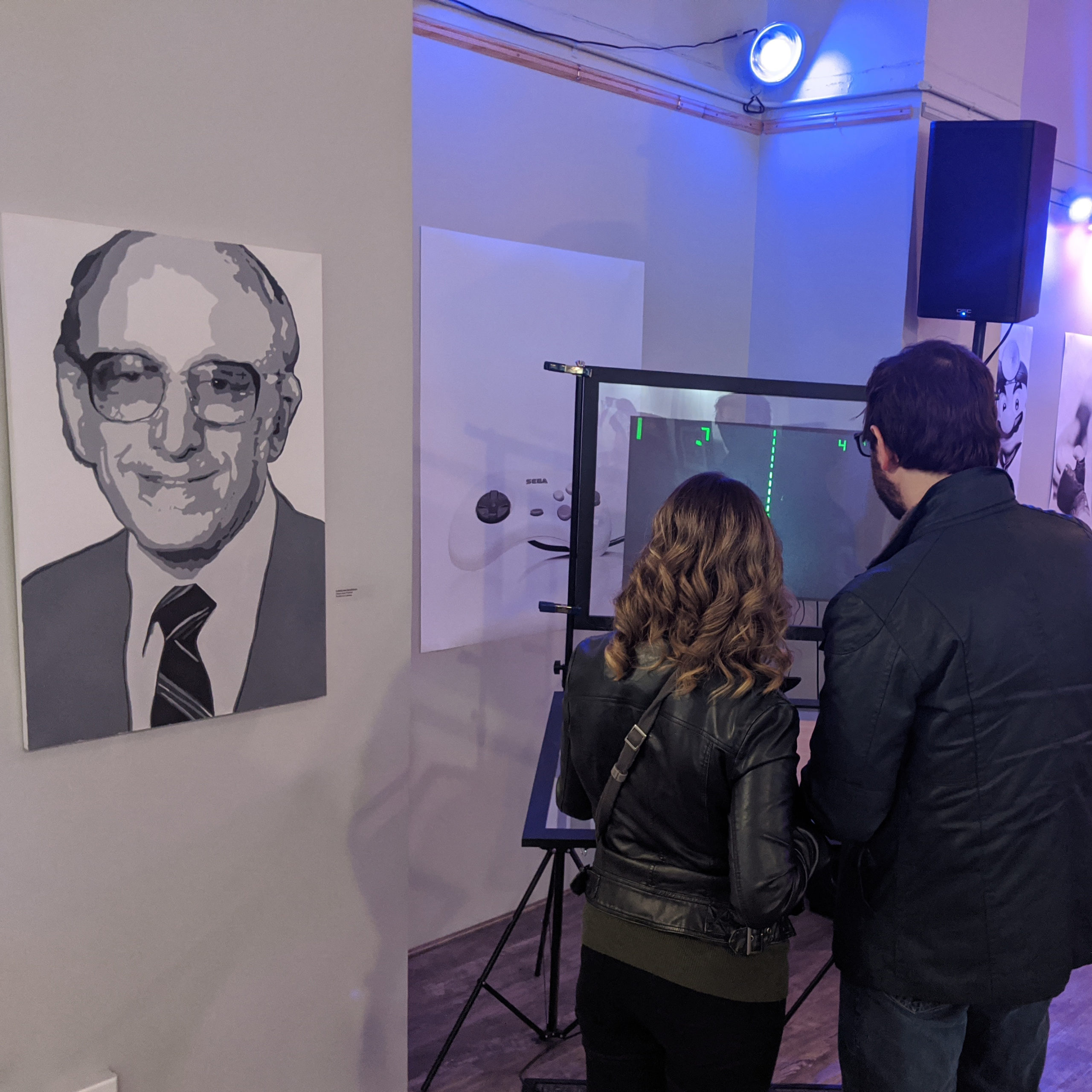 A couple plays an interactive game at a Ralph Baer event