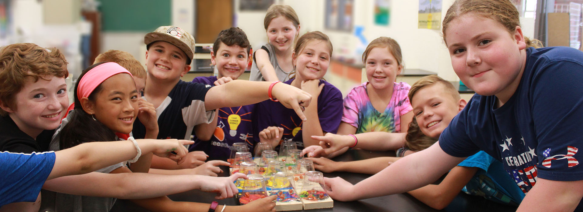 A group of campers point to the projects they gave made.