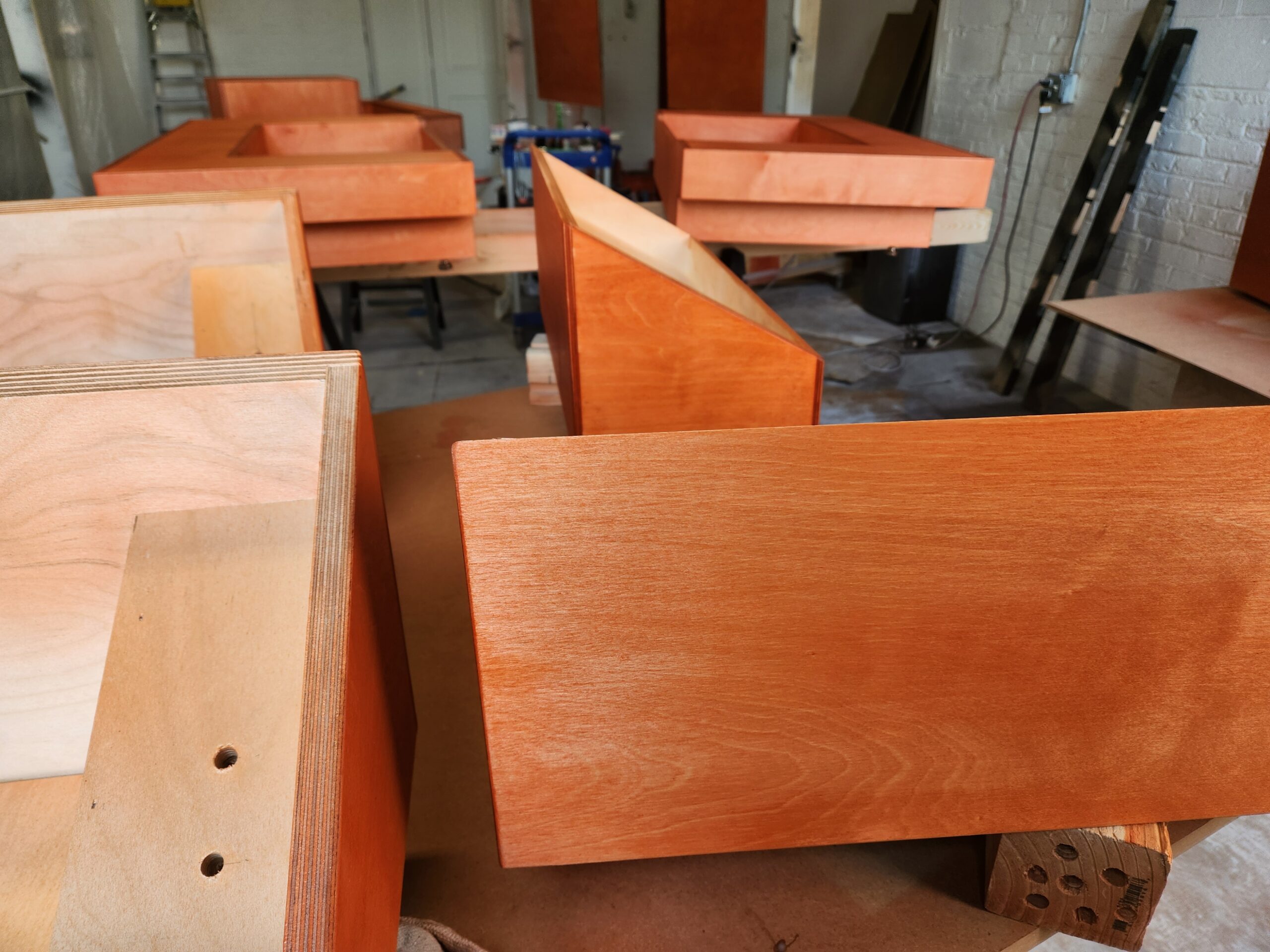 View of orange stained kiosks in a workshop
