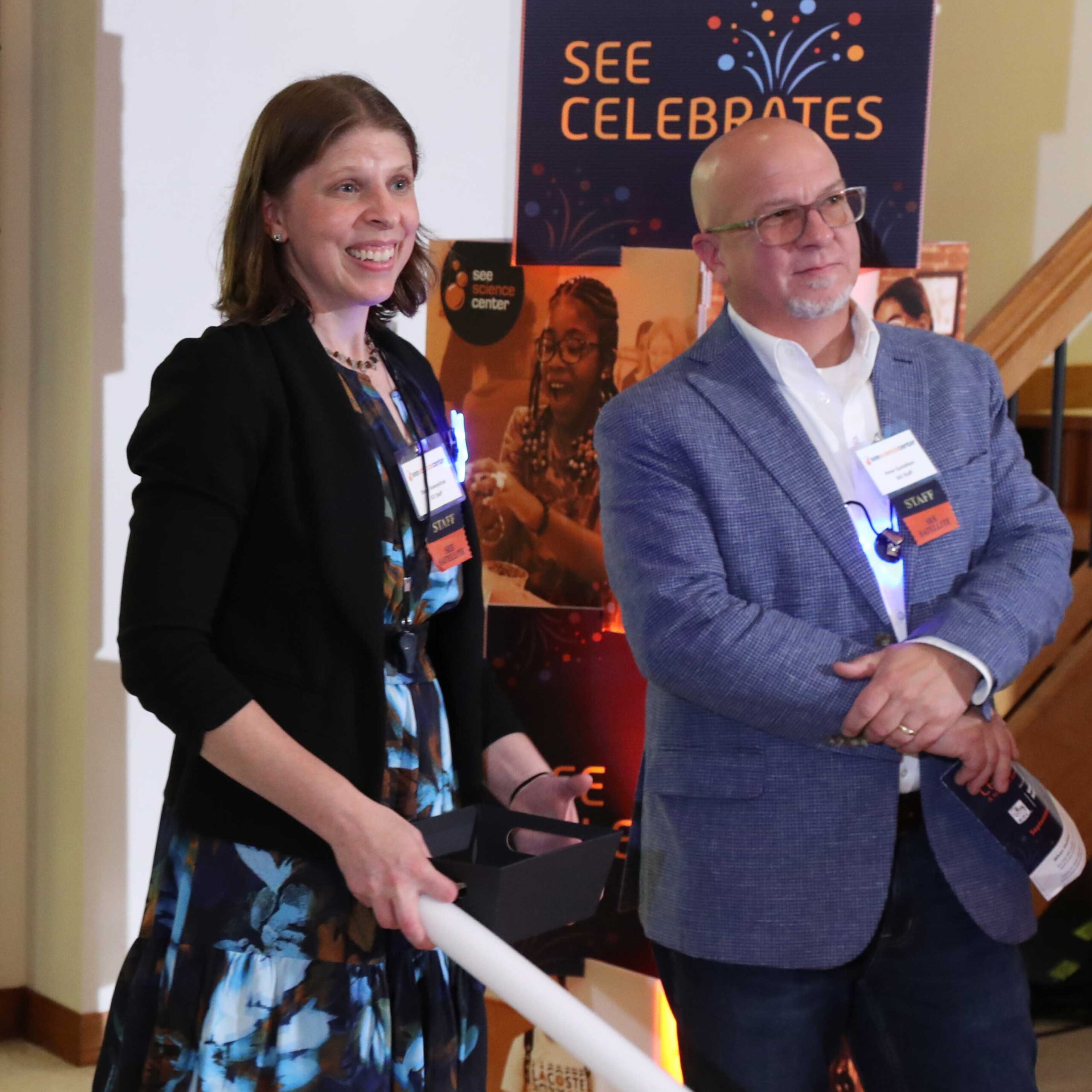 Executive director Shana and deputy director Pete take in the event.